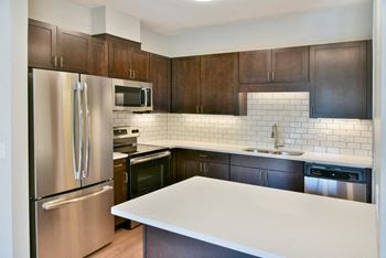 Quartz countertops, tile backsplash